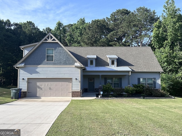 view of front of property with a front lawn and a garage