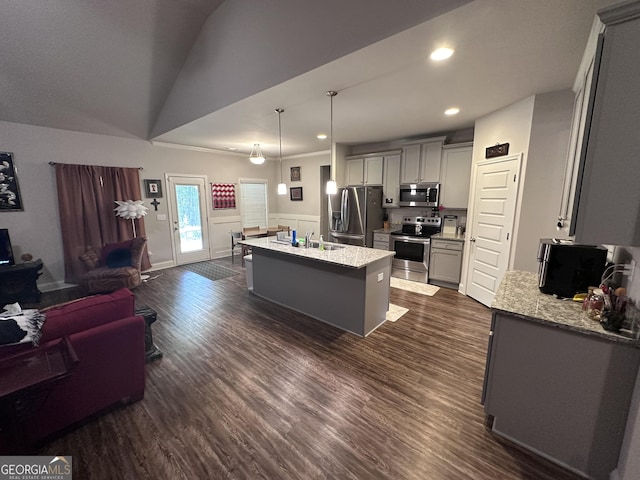 kitchen featuring light stone countertops, stainless steel appliances, a kitchen island with sink, dark wood-type flooring, and gray cabinets