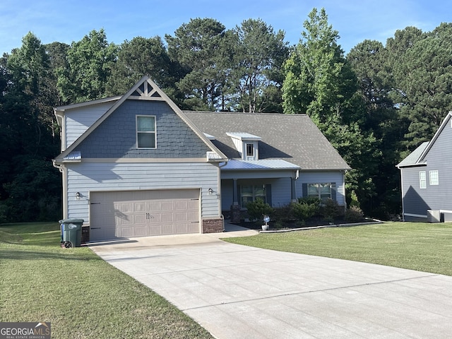 view of front facade with a front yard and a garage