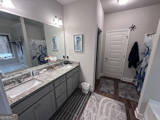 bathroom featuring separate shower and tub, hardwood / wood-style floors, and vanity