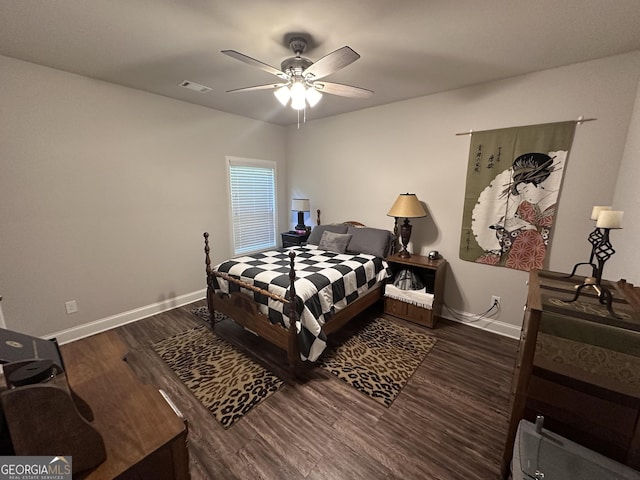 bedroom featuring ceiling fan and dark hardwood / wood-style floors