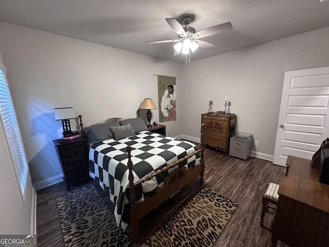 bedroom featuring ceiling fan and dark hardwood / wood-style flooring