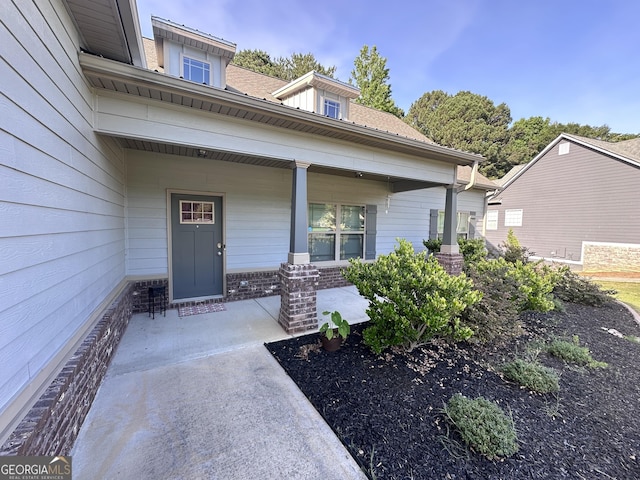 property entrance with covered porch