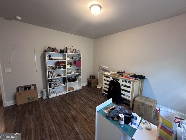 office space with dark wood-type flooring