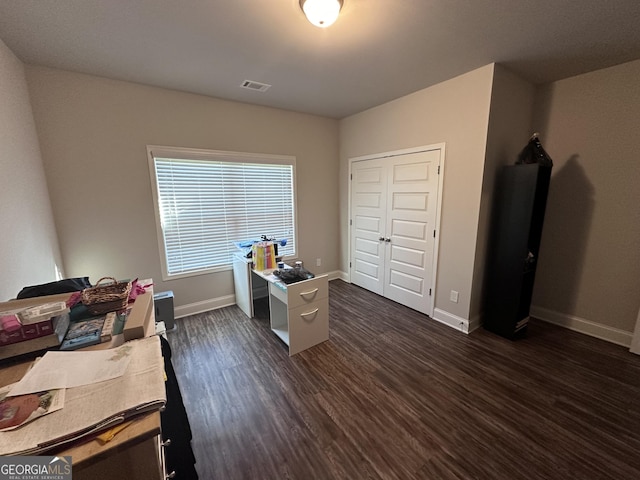 home office featuring dark hardwood / wood-style flooring