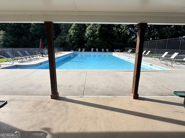 view of pool featuring a patio