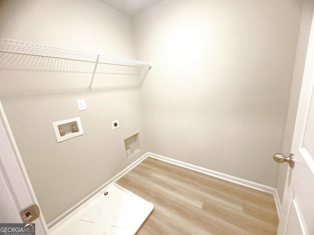 washroom with hardwood / wood-style floors, washer hookup, and hookup for an electric dryer