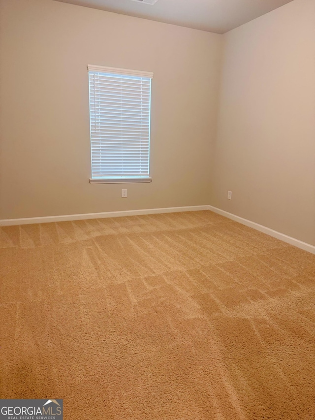 unfurnished room featuring carpet floors