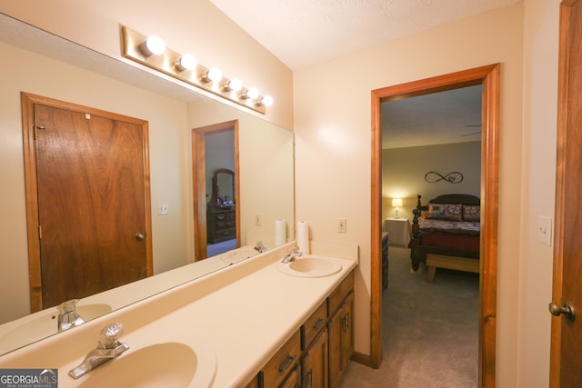 bathroom featuring vanity and a textured ceiling