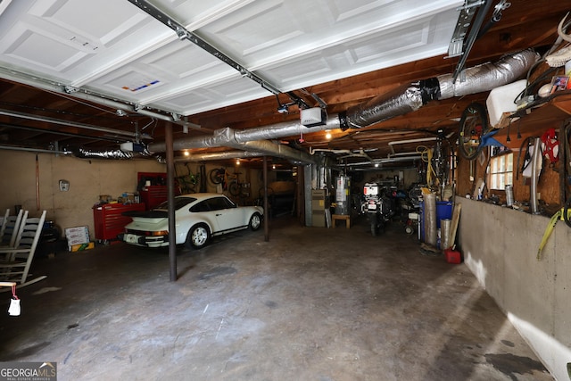 garage featuring a garage door opener and gas water heater