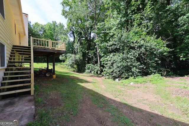 view of yard with a wooden deck