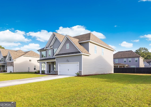 view of front of house with a garage and a front lawn