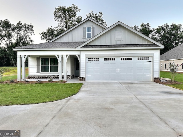 113 Chinaberry St Lot 4, Pine Mountain, GA 31822 - view of front of house with board and batten siding, concrete driveway, a front yard, an attached garage, and covered porch