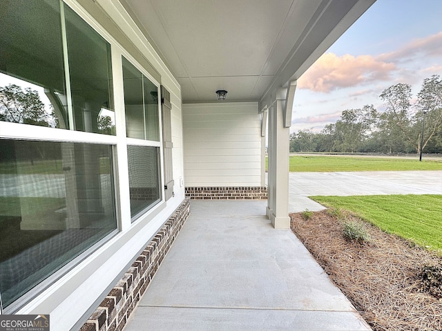 patio terrace at dusk with covered porch