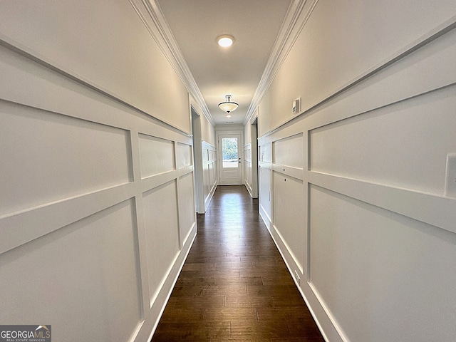 corridor with crown molding and dark wood-type flooring