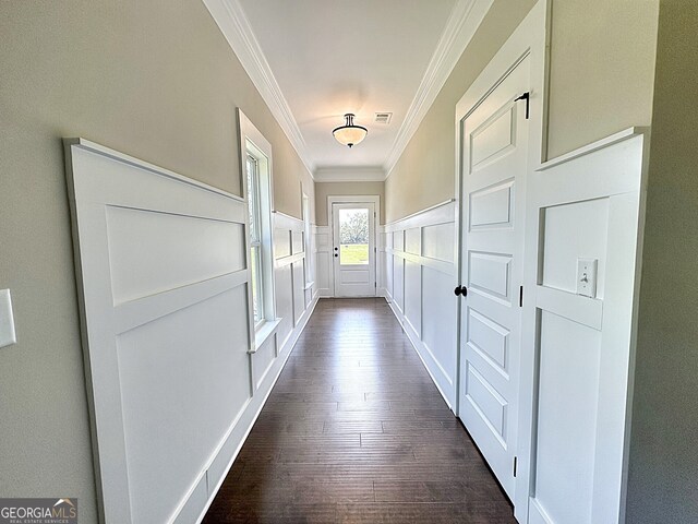 hall featuring ornamental molding and dark hardwood / wood-style floors