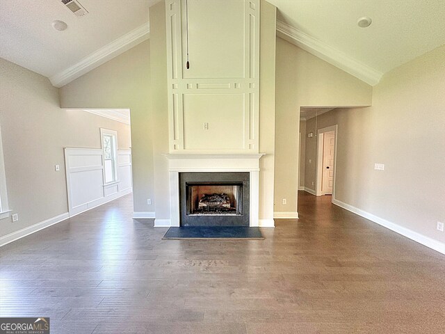 unfurnished living room with ornamental molding, a textured ceiling, dark hardwood / wood-style flooring, and high vaulted ceiling