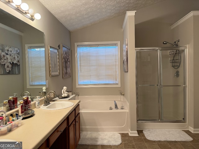 bathroom featuring a textured ceiling, plus walk in shower, tile floors, lofted ceiling, and large vanity