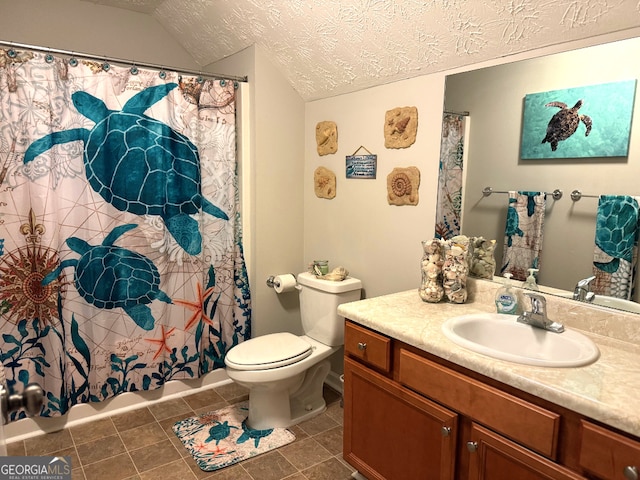 full bathroom with a textured ceiling, lofted ceiling, tile flooring, vanity, and toilet