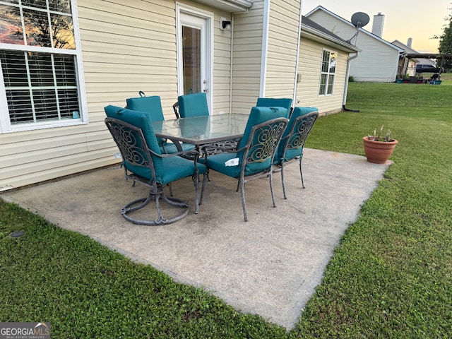 patio terrace at dusk with a yard