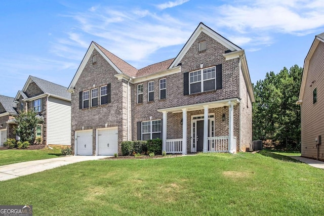 view of front of house featuring a garage, a front yard, central air condition unit, and covered porch