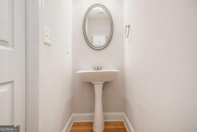 bathroom featuring hardwood / wood-style flooring