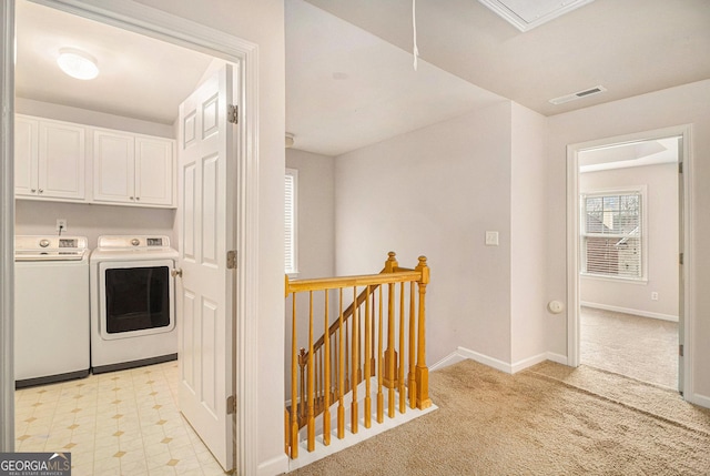 laundry area featuring cabinets and independent washer and dryer