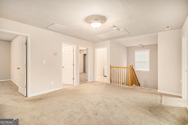 unfurnished room featuring carpet