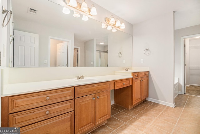 bathroom with tile patterned floors, vanity, and independent shower and bath