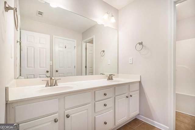 bathroom with vanity and tile patterned flooring