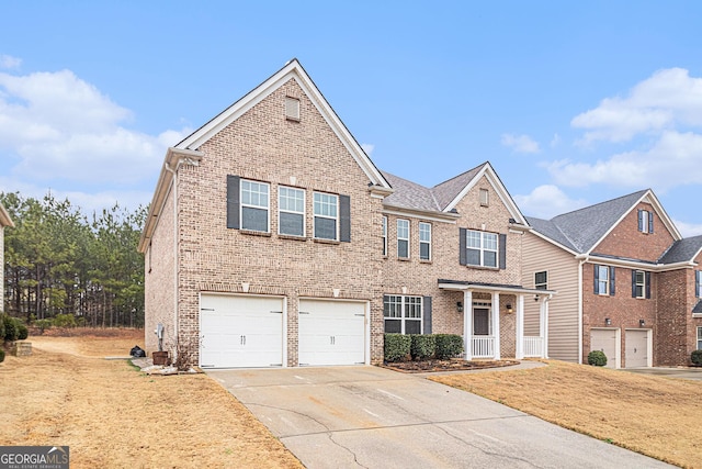 view of front of property featuring a garage and a front lawn