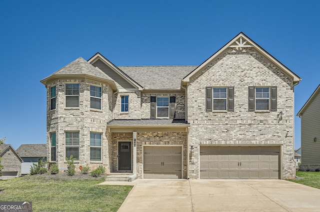 view of front of property with a garage