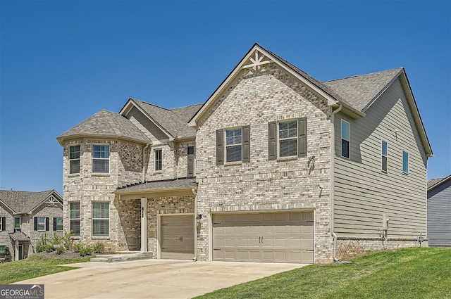 view of front of house with a garage, a front yard, concrete driveway, and brick siding