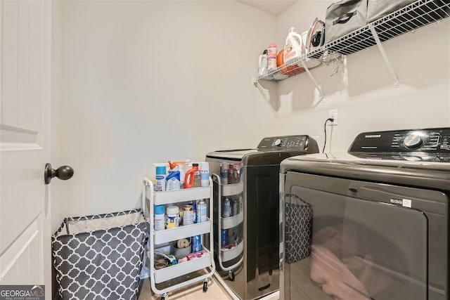 laundry area with independent washer and dryer