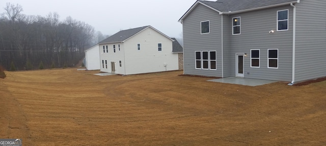 rear view of property featuring a patio