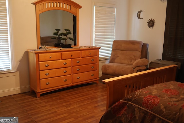 bedroom featuring wood-type flooring