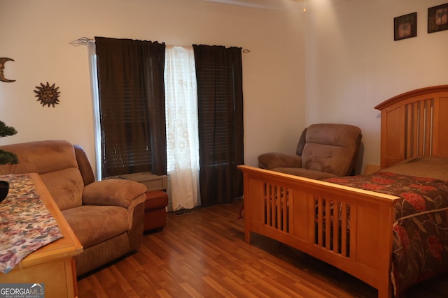 bedroom with hardwood / wood-style floors