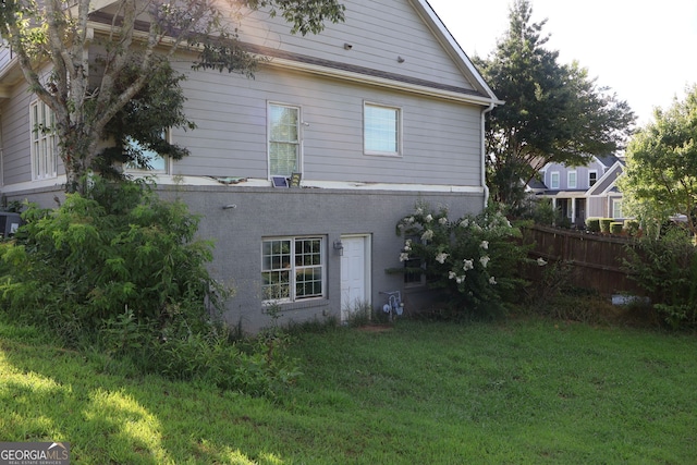 view of side of property with a yard