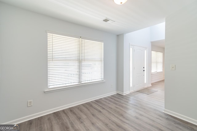 spare room with hardwood / wood-style flooring