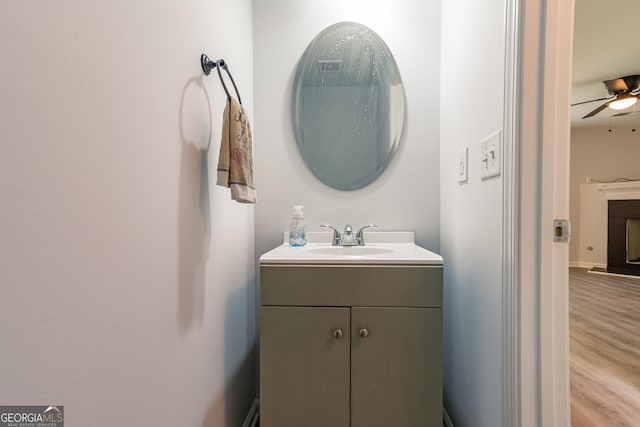 bathroom with vanity, wood-type flooring, and ceiling fan