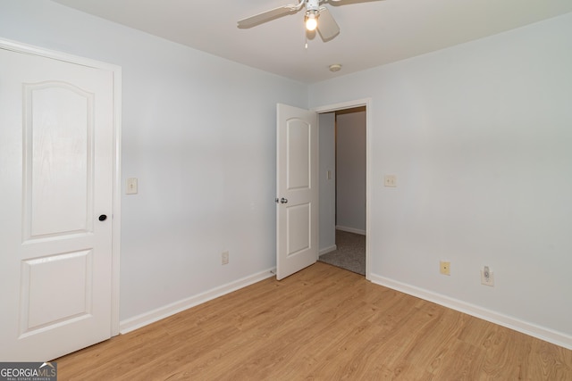 unfurnished room featuring ceiling fan and light wood-type flooring