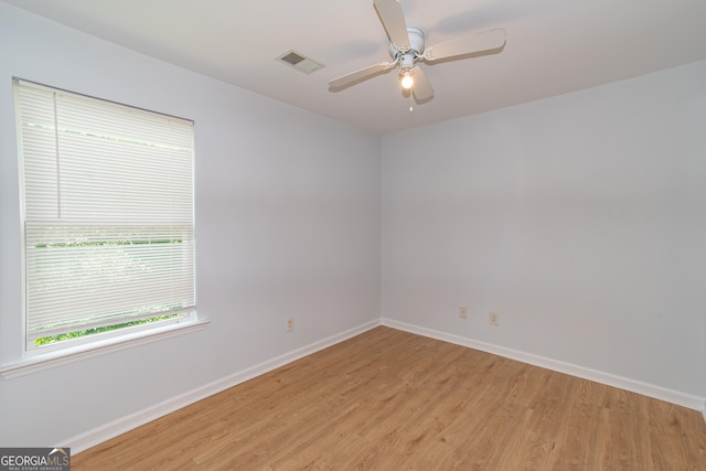 unfurnished room featuring ceiling fan and light hardwood / wood-style floors