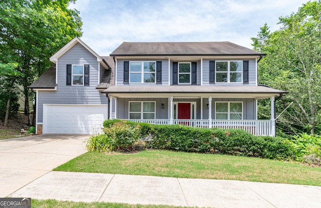 view of front of home with a garage, a porch, and a front lawn