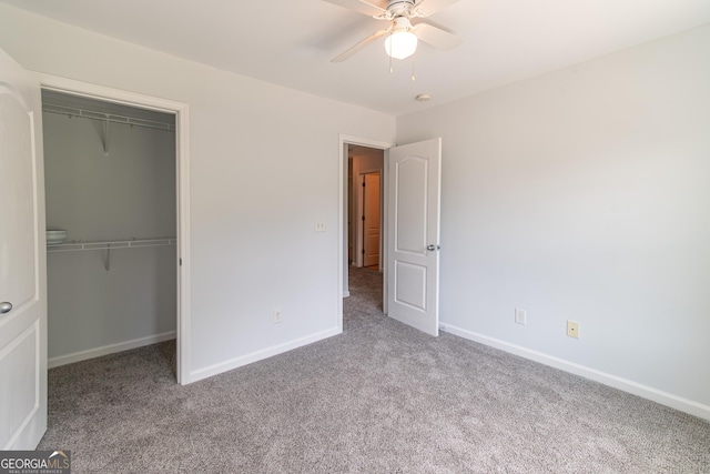 unfurnished bedroom with light colored carpet, a closet, and ceiling fan