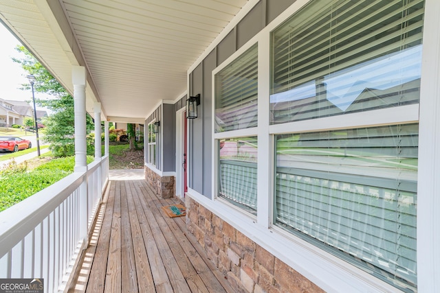 wooden terrace featuring a porch