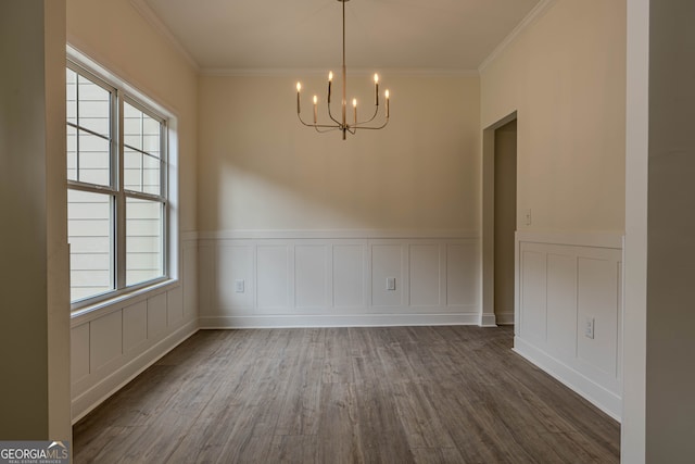 unfurnished dining area featuring crown molding, dark hardwood / wood-style floors, and a healthy amount of sunlight