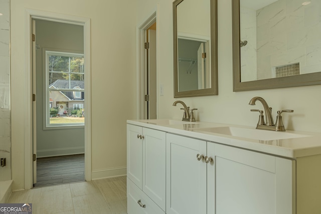 bathroom featuring vanity and wood-type flooring