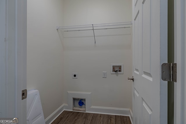 washroom with dark wood-type flooring, hookup for an electric dryer, and hookup for a washing machine