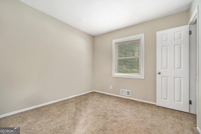 view of carpeted spare room