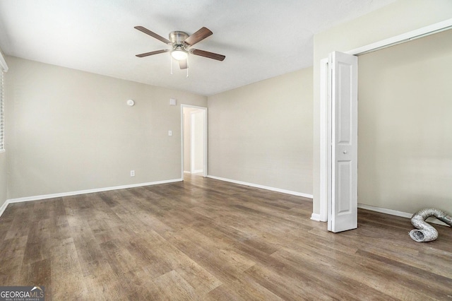 unfurnished room with wood-type flooring and ceiling fan